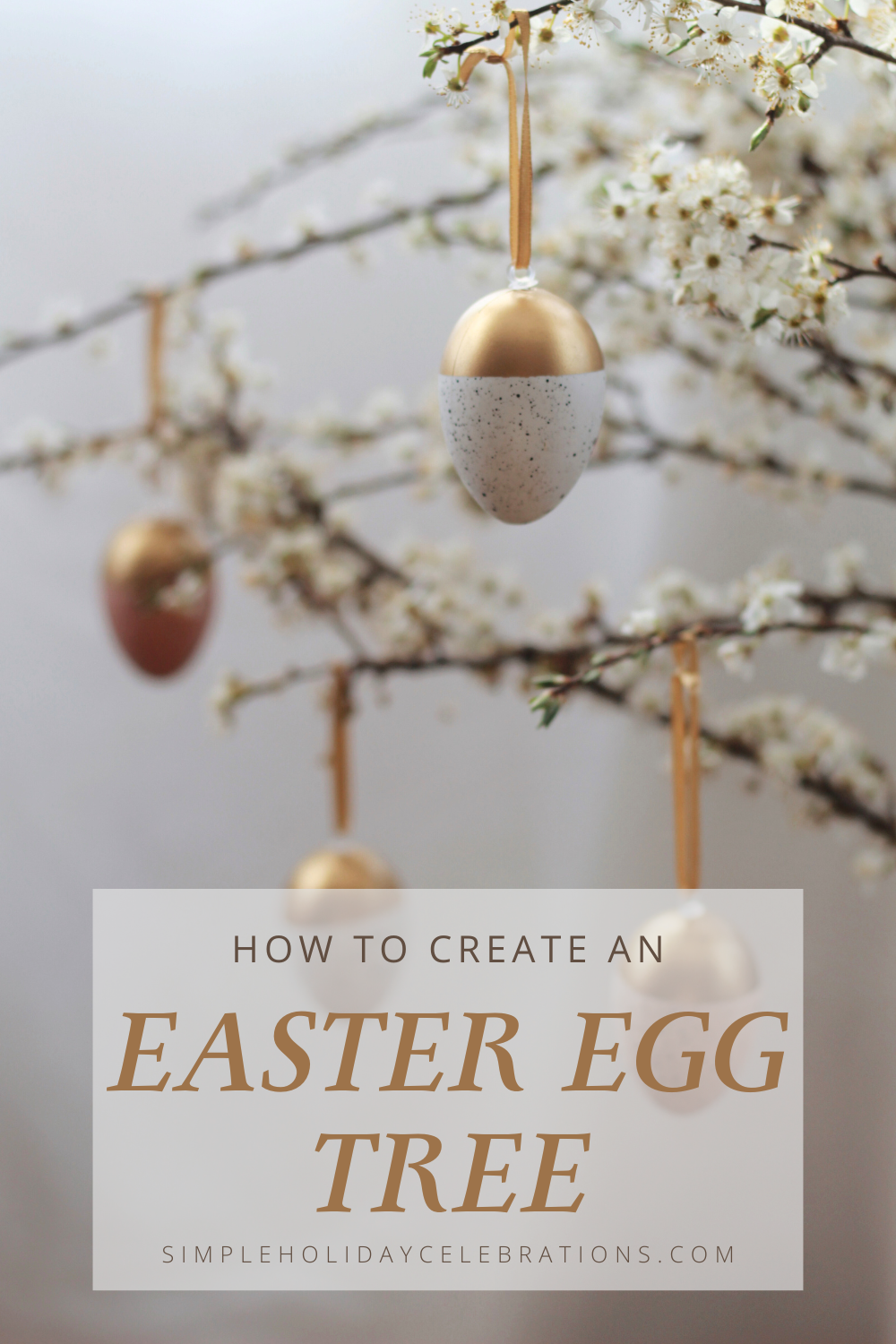 Pretty gold and white Easter Egg Tree with painted eggs hung on blooming White Dogwood Branches in a vase
